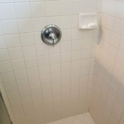 Grout and tile cleaning in bathroom